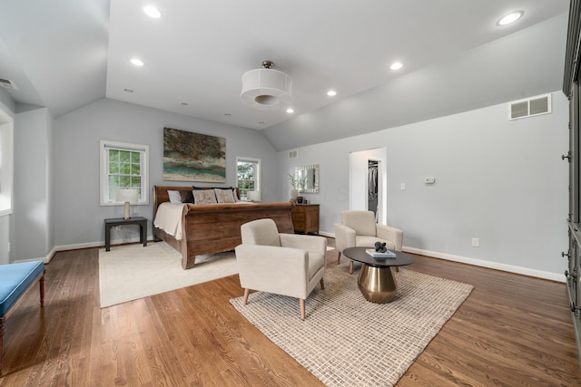 2656 Fair Ave, Columbus, OH 43209 - bedroom featuring vaulted ceiling, wood finished floors, baseboards, recessed lighting, and a walk in closet