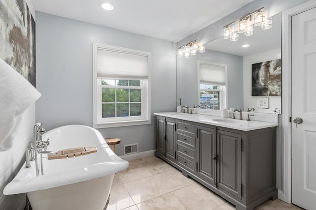 2656 Fair Ave, Columbus, OH 43209 - full bath featuring a freestanding bath, double vanity, plenty of natural light, recessed lighting, and baseboards