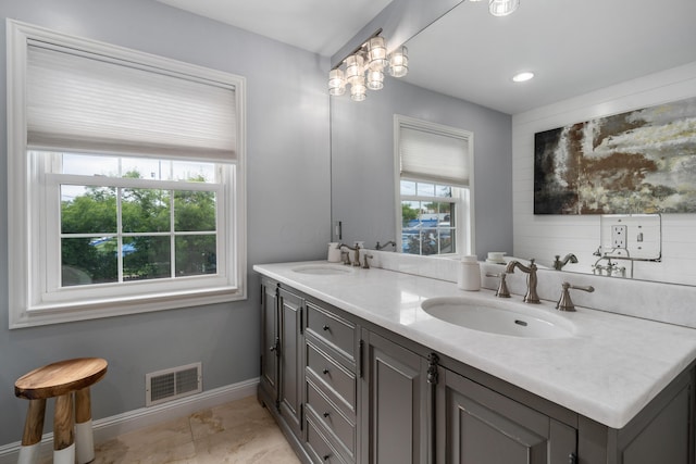 2656 Fair Ave, Columbus, OH 43209 - bathroom with double vanity and baseboards