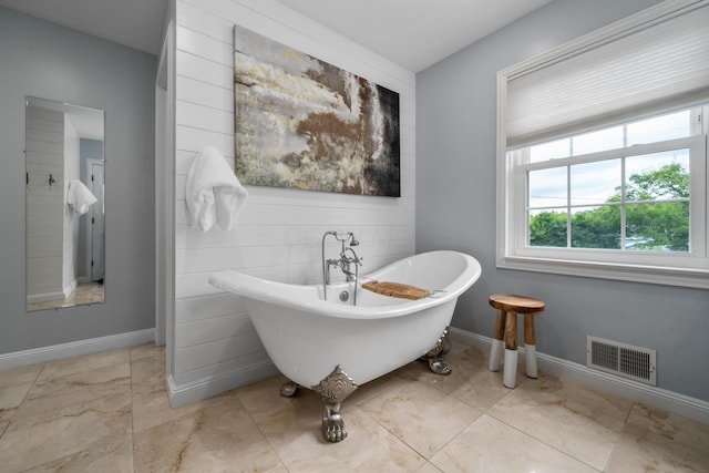 2656 Fair Ave, Columbus, OH 43209 - full bathroom with a soaking tub and baseboards