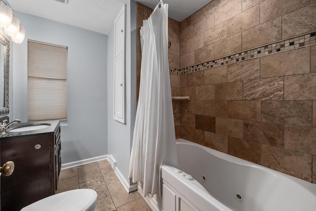 2656 Fair Ave, Columbus, OH 43209 - bathroom with baseboards, vanity, a combined bath / shower with jetted tub, and toilet