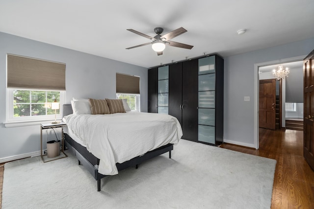 2656 Fair Ave, Columbus, OH 43209 - bedroom with wood finished floors, a chandelier, baseboards, and a ceiling fan