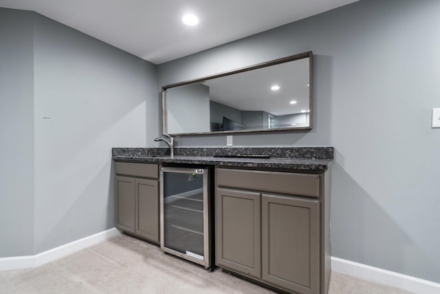 2656 Fair Ave, Columbus, OH 43209 - indoor wet bar featuring beverage cooler, light colored carpet, baseboards, and recessed lighting