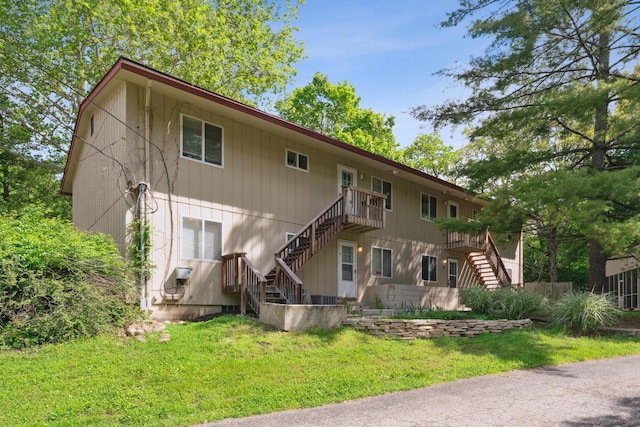 301 Fenway Rd Unit C, Columbus, OH 43214 - back of house featuring stairway and a lawn