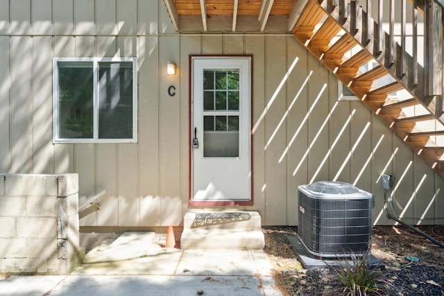 301 Fenway Rd Unit C, Columbus, OH 43214 - view of exterior entry featuring central AC unit and board and batten siding