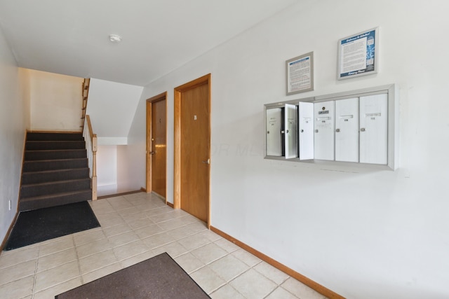 301 Fenway Rd Unit C, Columbus, OH 43214 - stairs featuring tile patterned flooring, baseboards, and mail area