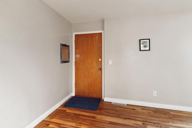 301 Fenway Rd Unit C, Columbus, OH 43214 - doorway to outside with baseboards and wood finished floors