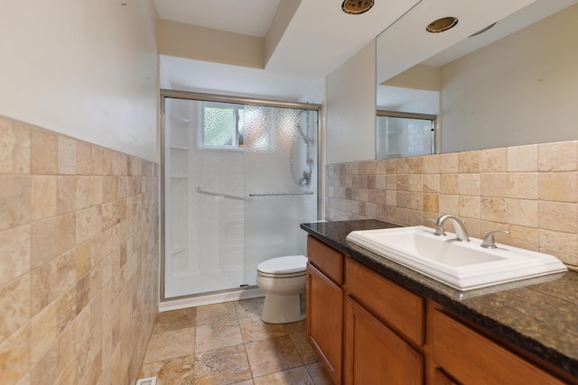 301 Fenway Rd Unit C, Columbus, OH 43214 - full bathroom featuring tile walls, toilet, vanity, a stall shower, and wainscoting