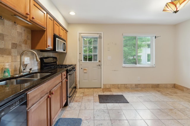 301 Fenway Rd Unit C, Columbus, OH 43214 - kitchen with stainless steel appliances, a sink, healthy amount of natural light, backsplash, and recessed lighting
