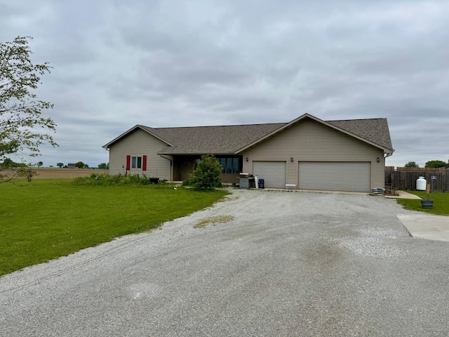 2580 Lafayette Plain City Rd, London, OH 43140 - ranch-style home with an attached garage, driveway, and roof with shingles