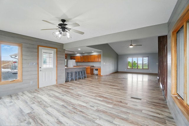 2580 Lafayette Plain City Rd, London, OH 43140 - unfurnished living room with a ceiling fan, light wood finished floors, baseboards, and vaulted ceiling