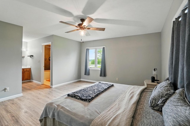 2580 Lafayette Plain City Rd, London, OH 43140 - bedroom featuring light wood-style flooring, baseboards, ensuite bath, and a ceiling fan