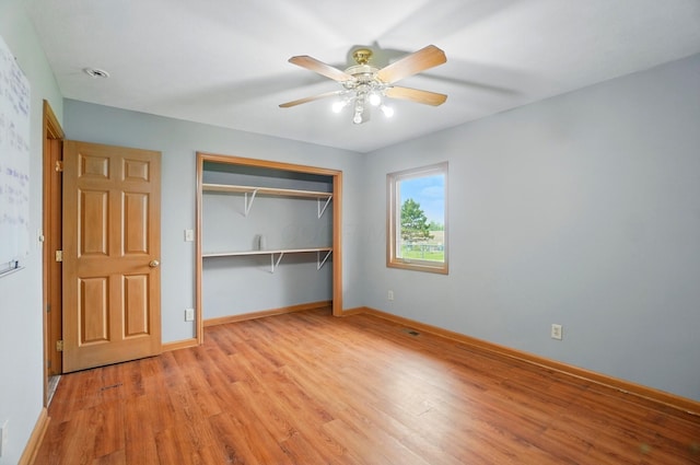 2580 Lafayette Plain City Rd, London, OH 43140 - unfurnished bedroom featuring light wood-style floors, a closet, baseboards, and ceiling fan