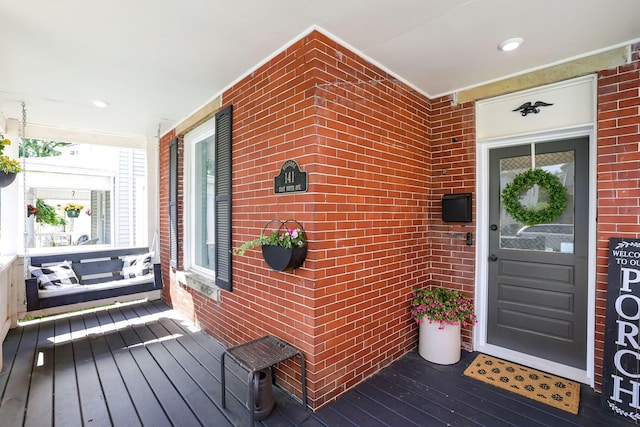 141 E 5th Ave, Lancaster, OH 43130 - property entrance with a porch and brick siding