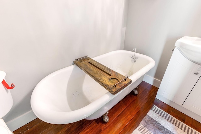 141 E 5th Ave, Lancaster, OH 43130 - full bath with a freestanding tub, wood finished floors, and baseboards