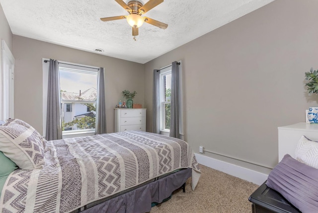 141 E 5th Ave, Lancaster, OH 43130 - bedroom with carpet flooring, a textured ceiling, ceiling fan, and baseboards