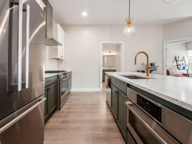 6633 Dale Dr Unit 417, Dublin, OH 43017 - kitchen with stainless steel appliances, a sink, wall chimney exhaust hood, light countertops, and recessed lighting