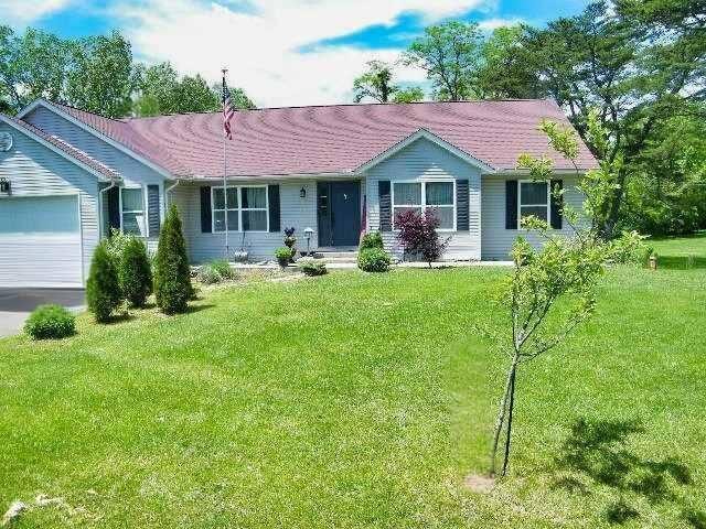 228 Jones Ave SW, Pataskala, OH 43062 - ranch-style house with an attached garage, a front lawn, and driveway