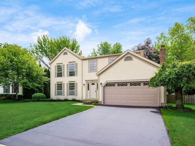 351 Northview Dr, Powell, OH 43065 - view of front of house with asphalt driveway, a chimney, and an attached garage