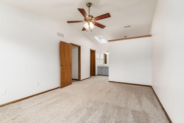 351 Northview Dr, Powell, OH 43065 - empty room featuring ceiling fan, light colored carpet, a skylight, lofted ceiling, and baseboards