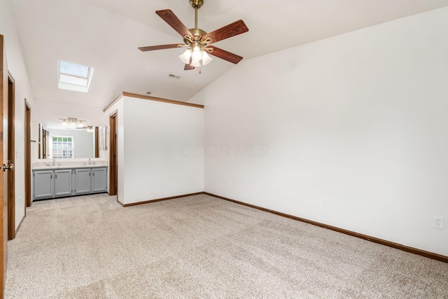 351 Northview Dr, Powell, OH 43065 - unfurnished bedroom with a skylight, lofted ceiling, light colored carpet, and a sink