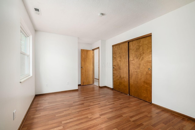 351 Northview Dr, Powell, OH 43065 - unfurnished bedroom featuring light wood finished floors, baseboards, and a closet