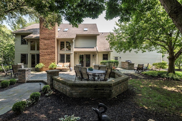 5714 Zetland Ct, Dublin, OH 43017 - rear view of house with a patio area, a chimney, and roof with shingles