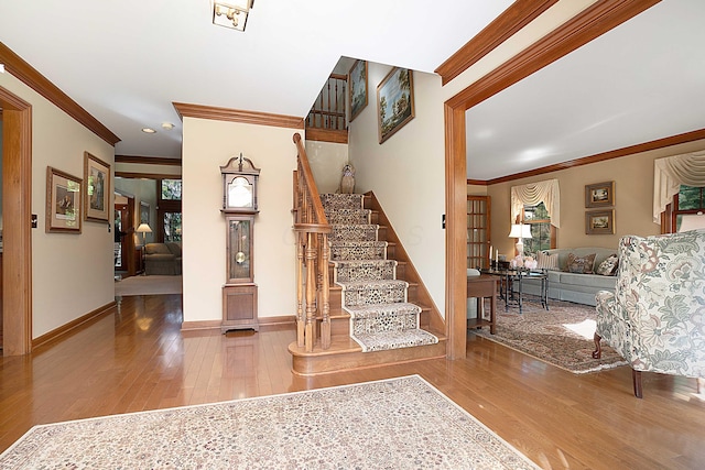 5714 Zetland Ct, Dublin, OH 43017 - foyer with ornamental molding, hardwood / wood-style flooring, stairway, baseboards, and recessed lighting