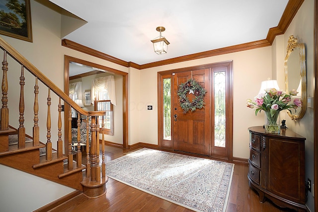 5714 Zetland Ct, Dublin, OH 43017 - entryway featuring baseboards, wood finished floors, stairs, and crown molding