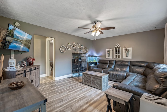 5250 Summit Rd SW, Pataskala, OH 43062 - living area with ceiling fan, light wood-style floors, baseboards, and a textured ceiling