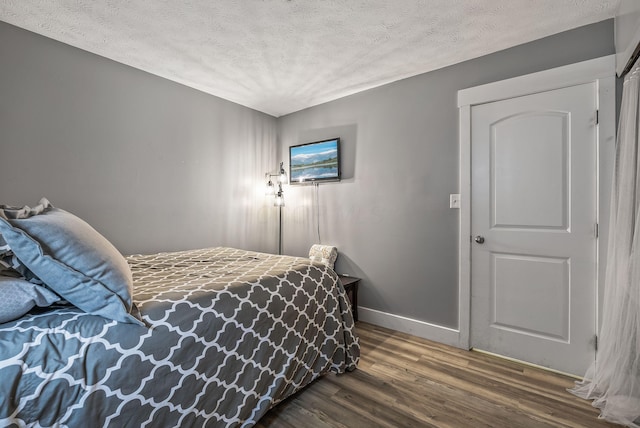 5250 Summit Rd SW, Pataskala, OH 43062 - bedroom with a textured ceiling, wood finished floors, and baseboards