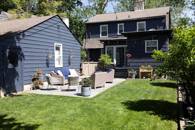 2443 Dale Ave, Columbus, OH 43209 - rear view of property with an outdoor living space, a chimney, a patio, a yard, and a shingled roof