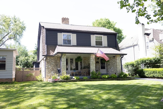 2443 Dale Ave, Columbus, OH 43209 - view of front of home featuring stone siding, covered porch, a chimney, and roof with shingles