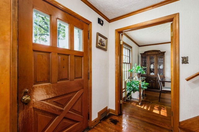 193 N Remington Rd, Columbus, OH 43209 - entryway with dark wood-style flooring, ornamental molding, a textured ceiling, and baseboards