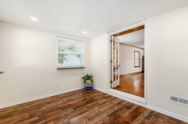 193 N Remington Rd, Columbus, OH 43209 - unfurnished room with wood finished floors, baseboards, recessed lighting, and a textured ceiling