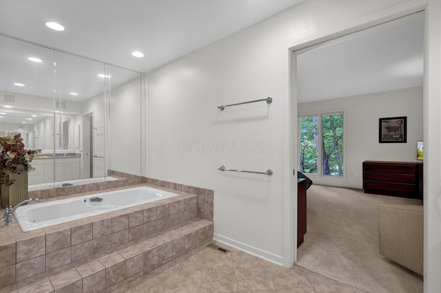 744 Old Oak Trce, Columbus, OH 43235 - bathroom with a garden tub, recessed lighting, tile patterned flooring, baseboards, and vanity