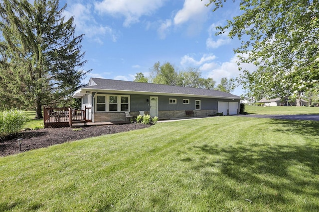 13441 Graham Rd SW, Pataskala, OH 43062 - rear view of property with a deck, a garage, a lawn, and asphalt driveway