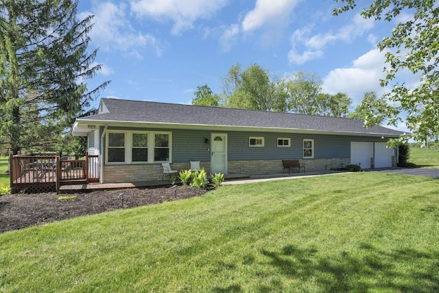 13441 Graham Rd SW, Pataskala, OH 43062 - ranch-style home with a garage, a deck, driveway, a front yard, and a shingled roof