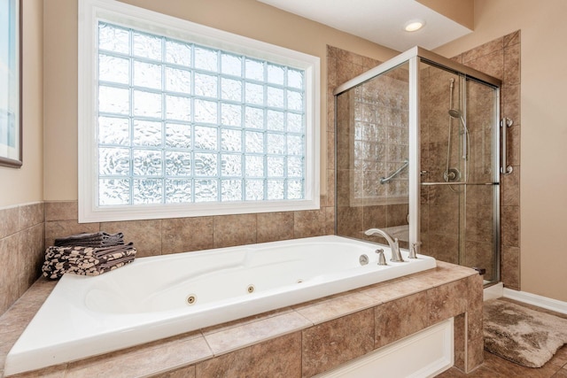 165 Tinley Park Cir, Delaware, OH 43015 - full bathroom featuring a stall shower, a jetted tub, and healthy amount of natural light