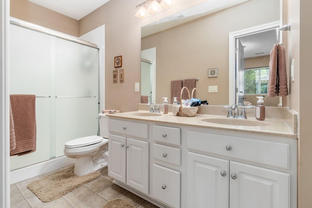 165 Tinley Park Cir, Delaware, OH 43015 - full bathroom featuring double vanity, a shower stall, and tile patterned floors