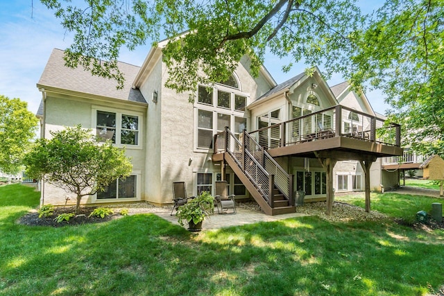 165 Tinley Park Cir, Delaware, OH 43015 - rear view of house featuring stucco siding, a patio area, a deck, a lawn, and stairs