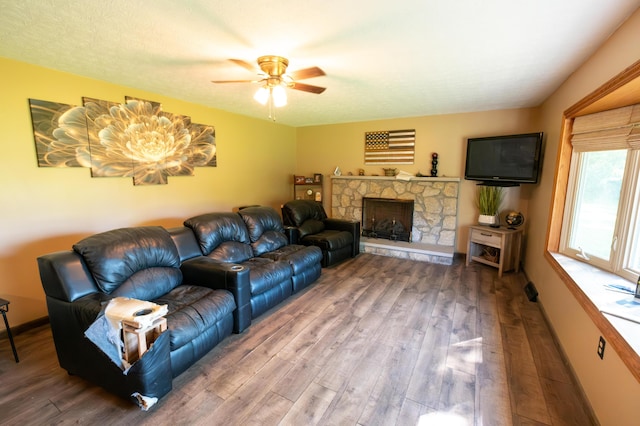 9442 Mitchell Dewitt Rd, Plain City, OH 43064 - living room featuring wood finished floors, ceiling fan, a fireplace, and baseboards