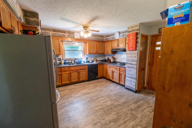 9442 Mitchell Dewitt Rd, Plain City, OH 43064 - kitchen featuring freestanding refrigerator, dishwasher, under cabinet range hood, a textured ceiling, and light wood-type flooring