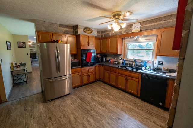 9442 Mitchell Dewitt Rd, Plain City, OH 43064 - kitchen featuring black appliances, a textured ceiling, a sink, dark wood-type flooring, and a ceiling fan