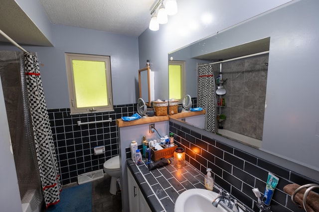 9442 Mitchell Dewitt Rd, Plain City, OH 43064 - full bath featuring tile walls, a tile shower, toilet, wainscoting, and vanity