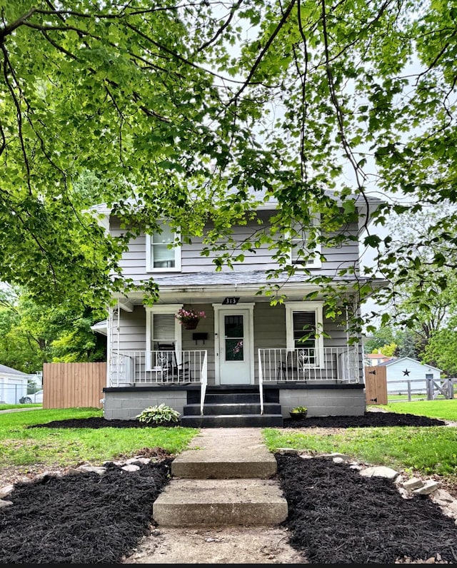 313 E Auburn Ave, Bellefontaine, OH 43311 - view of front of house with a porch