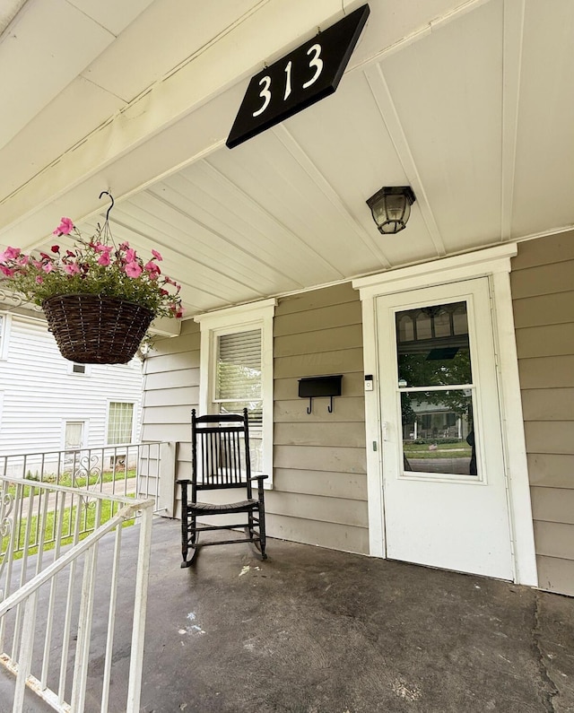 313 E Auburn Ave, Bellefontaine, OH 43311 - view of exterior entry with a porch