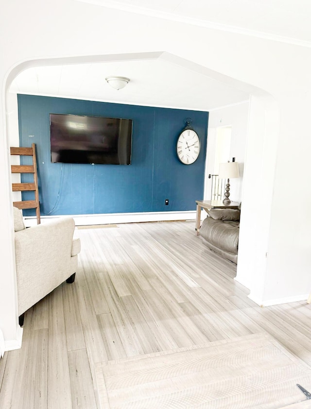 313 E Auburn Ave, Bellefontaine, OH 43311 - living room featuring wood finished floors, baseboards, and arched walkways