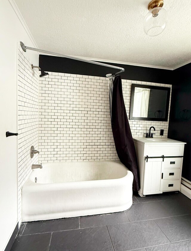 313 E Auburn Ave, Bellefontaine, OH 43311 - full bath with shower / bathtub combination with curtain, vanity, tile patterned floors, crown molding, and a textured ceiling