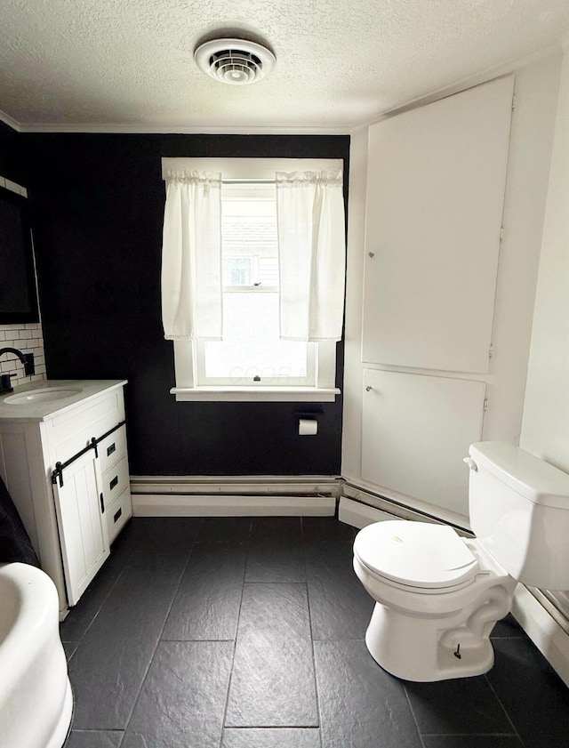 313 E Auburn Ave, Bellefontaine, OH 43311 - bathroom with toilet, a textured ceiling, vanity, and tile patterned flooring
